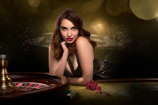 A glamorous woman holding casino chips in a neon-lit environment, representing the premium online casino atmosphere of T BAAZI.